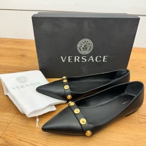 Versace black leather flats with gold Medusa head adornments